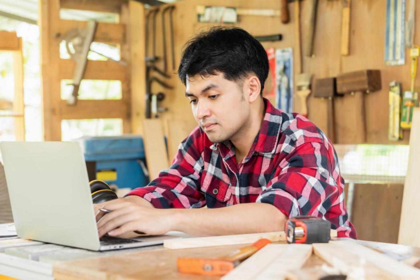Group of students collaboratively reviewing website audit findings on shared workspace